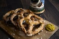 German Pretzels Snacks Beer Stein and Mustard on Wood