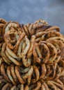 German pretzels stack one over each other, group of thin dry pretzels on rope on display Royalty Free Stock Photo