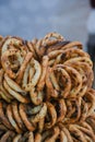 German pretzels stack one over each other, group of thin dry pretzels on rope on display Royalty Free Stock Photo