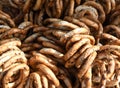 German pretzels stack one over each other, group of thin dry pretzels on rope Royalty Free Stock Photo