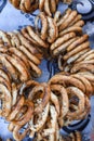 German pretzels stack one over each other, group of thin dry pretzels on rope Royalty Free Stock Photo