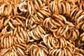 German pretzels stack one over each other, group of thin dry pretzels on rope Royalty Free Stock Photo