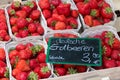 German red strawberries market baskets with euro price sign Royalty Free Stock Photo