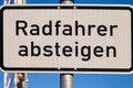 German road sign for cyclists to dismount their bike