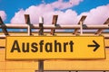 German road sign. Exit sign with an arrow pointing to the right in a supermarket. A yellow sign with the German word Ausfahrt Royalty Free Stock Photo