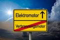 German road sign with the german words for electric motor - Elektromotor and combustion engine - Verbrennungsmotor with blue and d