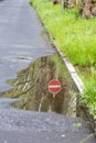 German road sign for one way and forbidden direction as restriction and prohibition for cars and road traffic as nice reflection Royalty Free Stock Photo