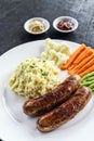 German sausage with mashed potato and vegetables meal Royalty Free Stock Photo