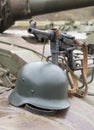 German Schmeisser submachine gun and helmet on the armor of the