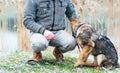 German shepherd puppy with owner at winter Royalty Free Stock Photo