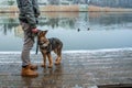 German shepherd puppy with owner at winter Royalty Free Stock Photo