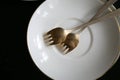 German silver dessert forks on the plate Royalty Free Stock Photo