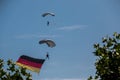German skydiver in the air with German flag Royalty Free Stock Photo