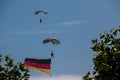 German skydiver in the air with German flag Royalty Free Stock Photo
