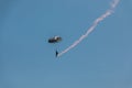 German skydiver in the air with a tail of smoke Royalty Free Stock Photo