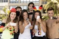 German soccer fans holding smartphones