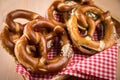 German soft Brezel pretzel with salt, chives and butter in bread basket Royalty Free Stock Photo