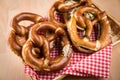 German soft Brezel pretzel with salt, chives and butter in bread basket Royalty Free Stock Photo