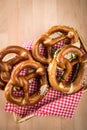 German soft Brezel pretzel with salt, chives and butter in bread basket