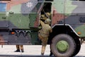 German soldier is moving into military infantry vehicle, Dingo