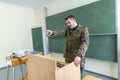 German soldier stands in a classroom