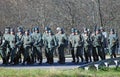 German soldiers-reenactors walk with guns Royalty Free Stock Photo