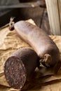 German specialty blood sausage Blutwurst on wooden table Royalty Free Stock Photo