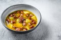 German Split pea soup with smoked sausages. White background. Top view. Copy space Royalty Free Stock Photo