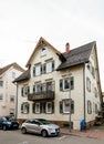 German street with German house and german car and kid on skate