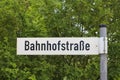 German street sign translates into railroad station street in English