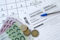 German tax form with pen and european money bills lies on office calendar. Taxpayers in Germany using euro currency to pay taxes Royalty Free Stock Photo