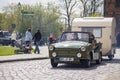 German trabant car with trailer drives on a street