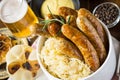 Traditional Grilled Sausages with Cabbage Salad, Mustard and Beer Royalty Free Stock Photo