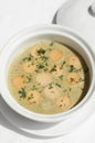 German traditional KARTOFFELSUPPE potato and sausage soup on white background
