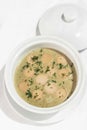 German traditional KARTOFFELSUPPE potato and sausage soup on white background Royalty Free Stock Photo