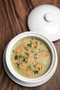 German traditional KARTOFFELSUPPE potato and sausage soup on wood table Royalty Free Stock Photo
