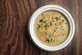 German traditional KARTOFFELSUPPE potato and sausage soup on wood table Royalty Free Stock Photo