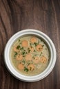 German traditional KARTOFFELSUPPE potato and sausage soup on wood table Royalty Free Stock Photo