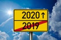 German traffic sign with 2020 and 2019 in front of blue sky Royalty Free Stock Photo