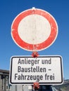 German traffic sign: Passage forbidden. Exception for residents and construction vehicles. Royalty Free Stock Photo