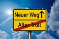 German traffic sign the words for New Way - Old Way - Neuer Weg - Alter Trott Royalty Free Stock Photo