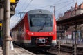 German train passes a train station