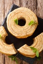 German for tree cake, Baumkuchen is sometimes also known as pyramid cake, or spit cake close-up. Vertical top view Royalty Free Stock Photo