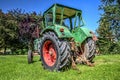 German vintage tractor stands on a green meadow Royalty Free Stock Photo