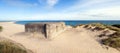 German war bunker on beach by sea