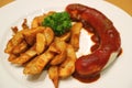 German Weisswurst Sausage with Curry Ketchup and Fried Potatoes Royalty Free Stock Photo