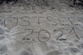 The German word `Baltic Sea 2021` laid with stones in the sand