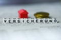 German Word INSURANCE formed by alphabet blocks: VERSICHERUNG