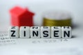 German Word INTEREST formed by alphabet blocks: ZINSEN