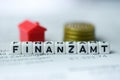 German Word TAX Office formed by alphabet blocks: FINANZAMT